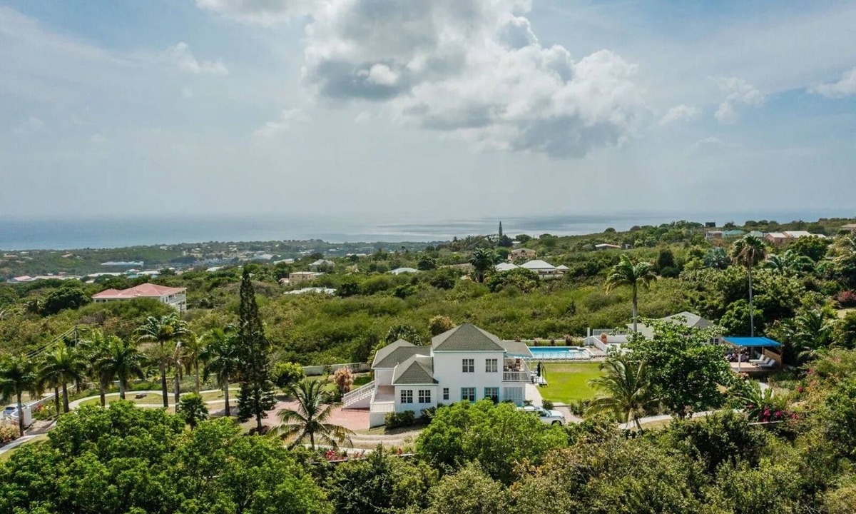 Charlestown Villa | Wake up to ocean views and emerald peaks in this stunning Caribbean sanctuary