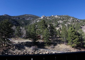 Beautiful river and mountain views prevail from this 3-bedroom, 2-bath condo. in Estes Park