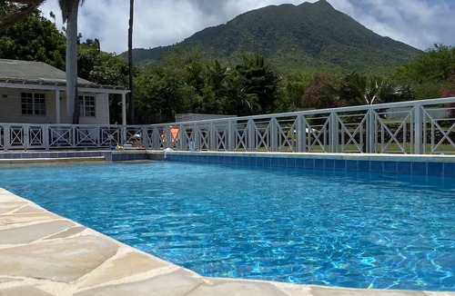 Charlestown Villa | Wake up to ocean views and emerald peaks in this stunning Caribbean sanctuary