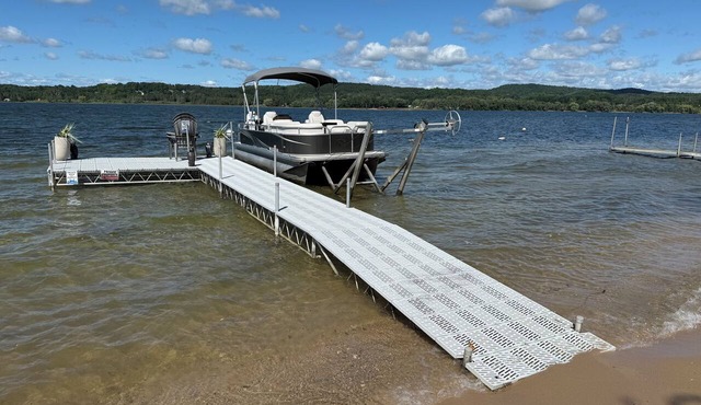 Private DOCK & BEACH on Lake Charlevoix + Pontoon Boat & Golf-Cart + RV Parking in East Jordan