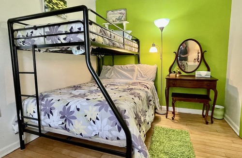 Manistee House | Charming Cottage. Walk to the beach and pet friendly - huge fenced yard.
